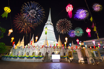 White pagoda in Wat-Prayoon Rawongsawaswith new year fireworks,