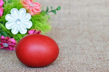 Red Easter egg and fabric flowers