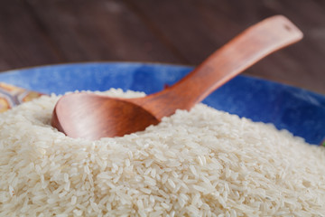 White rice on a plate, big spoon on the side