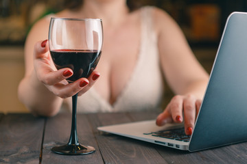 woman holding wine glass