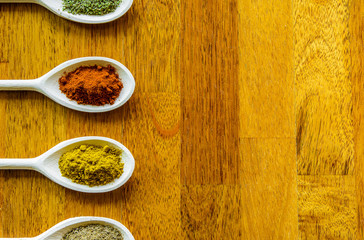 Collection of various food ingredients in wooden spoons