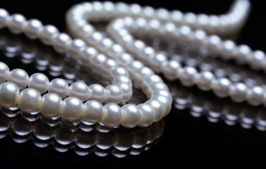 beautiful pearls on black background