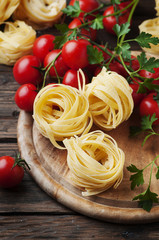 Ingredients for cooking pasta and tomato on the table