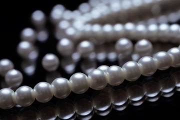beautiful pearls on black background