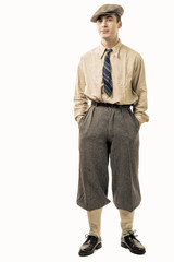 Young man with clothes and cap in 20s style.