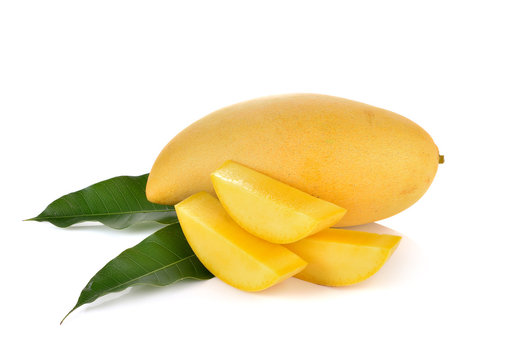 ripe mango with green leaf on white background.