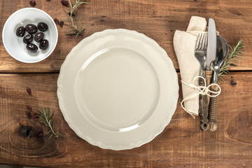 Rustic Old Wooden Table With Plate and Cutlery