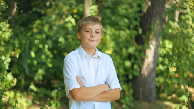 Caucasian Joyful child teenager boy looking in camera and smiling