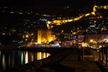 Fototapeta na wymiar Night view of harbour, fortress and ancient shipyard in Alanya, Turkey.