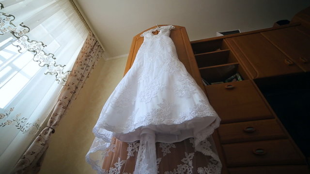 Wedding dress in motion. Festive beautiful clothes for girl, female, miss, lady