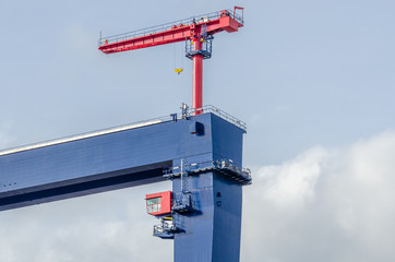 The site with cranes against blue sky
