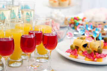 Set of cold snacks, canape, beverages, closeup