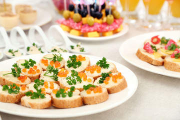 Set of cold snacks, canape, beverages, closeup