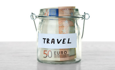 Jar for savings full of coins