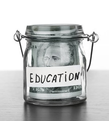 Jar for savings full of banknotes