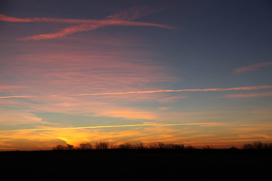 Fototapeta Sunrise with Jet Contrails