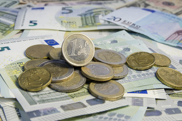 Euro coins on banknotes