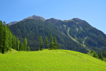 Fototapeta na wymiar Beautiful Alpine landscape with mountain range. Canton Graubunden, Switzerland