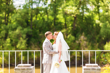 Wedding, Beautiful Romantic Bride and Groom Kissing and Embracing 