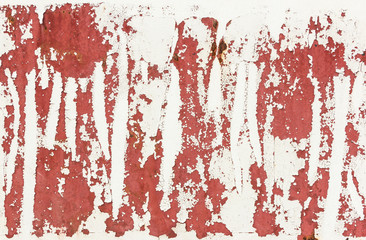 painted white cracked on red metal wall