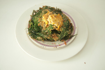 cha-om omelet in white plate