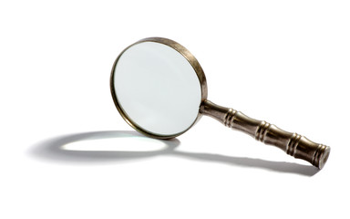 Round metal magnifying glass with a shadow