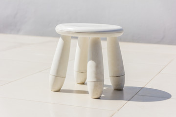 Old baby white plastic stool
