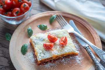 Lasagna with cherry tomatoes and fresh basil: top view