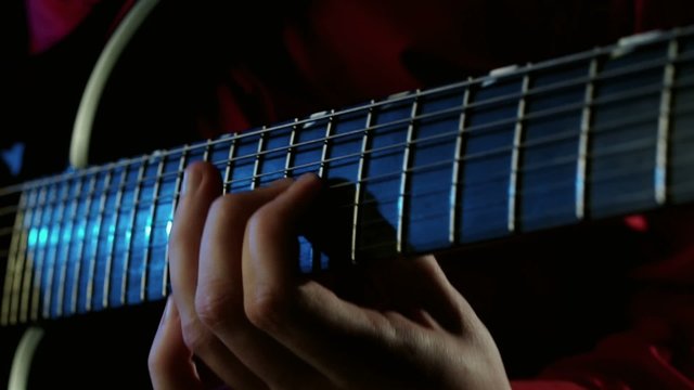 Man Lead Guitarist Playing Solo On Electric Guitar.