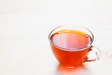 Cup of tea on white wooden background