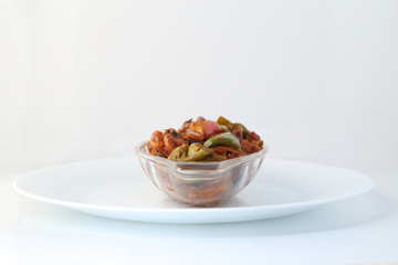 Indian food or Chinese food. Chicken with sweet and sour sauce.