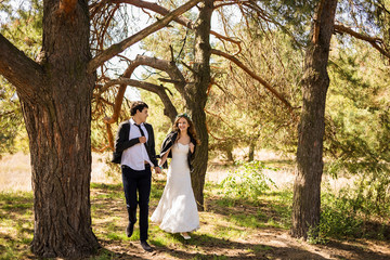 bride and groom go for a walk