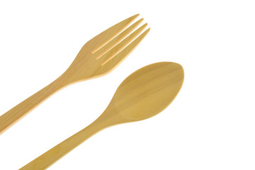 Brown wooden spoon and fork on white