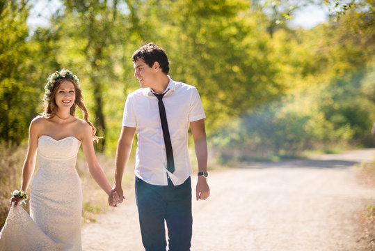 bride and groom go for a walk