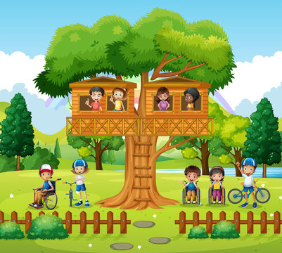 Children playing at the treehouse in the park