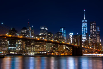 Fototapeta na wymiar Manhattan and the Brooklyn Bridge. Evening