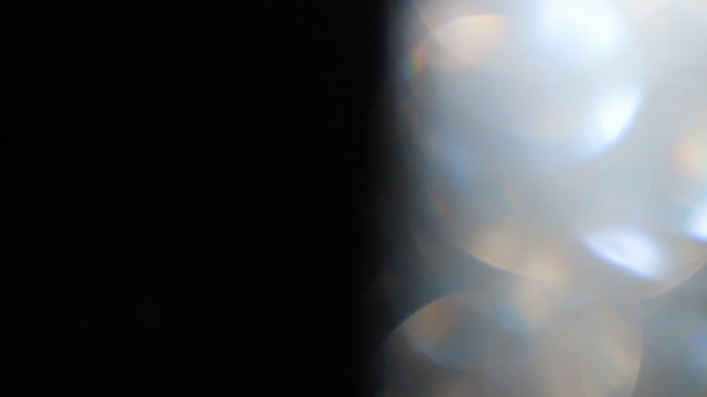 the video futage bokeh, glitter, glare overlay.  Celebration, festive, cheerful, gala. Use blending modes, screen mode in the video editing program.    