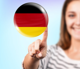 Woman point on the bubble with german flag