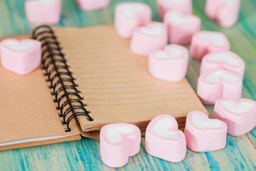 recycle note book and pen with sweet heart shape on