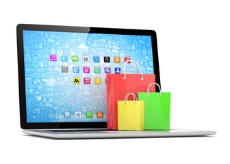 laptop and  shopping pags on white background