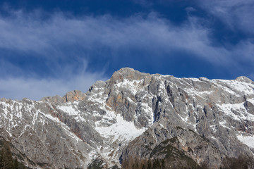 Fototapeta na wymiar Panoramic view of idyllic winter wonderland with mountain tops i
