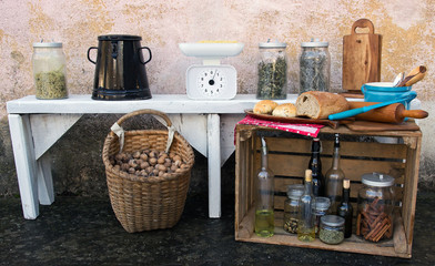 Fototapeta na wymiar Vintage Kitchen Utensils Still Life with Food and Other Tools in Front of Grunge Wall Texture