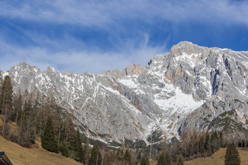 Panoramic view of idyllic winter wonderland with mountain tops i