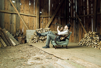 Trumpet Musician is Playing in Wooden Shed