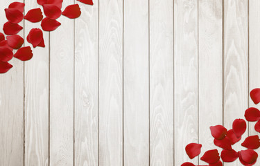 Petals on wooden background.