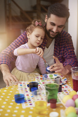 Painting Easter eggs with father