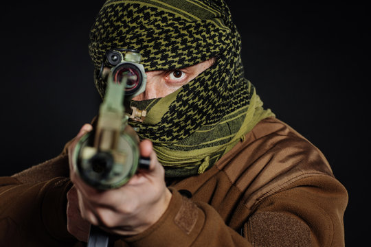 Terrorist with his rifle. Concept about terrorism.