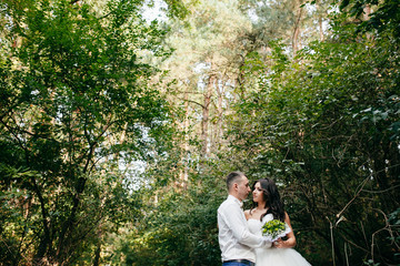 Wedding shot of bride and groom in park