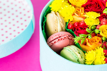 Obraz na płótnie Canvas Gift Box of Colourful Macaron with Flowers on Pink Background, Natural light, Bloom Box, Flower Box, Close-up, Horizontal, Valentines Day