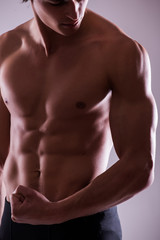 Fototapeta premium close up image of muscular perfect male torso